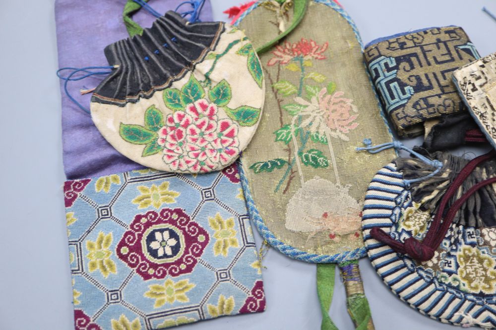 Six 19th century Chinese finely embroidered silk purses, pouches and pockets for carrying seals and coins, mostly embroidered with